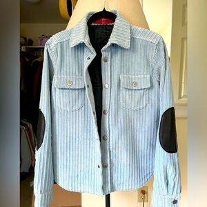Authier corduroy baby blue snap jacket with leather elbow patch.